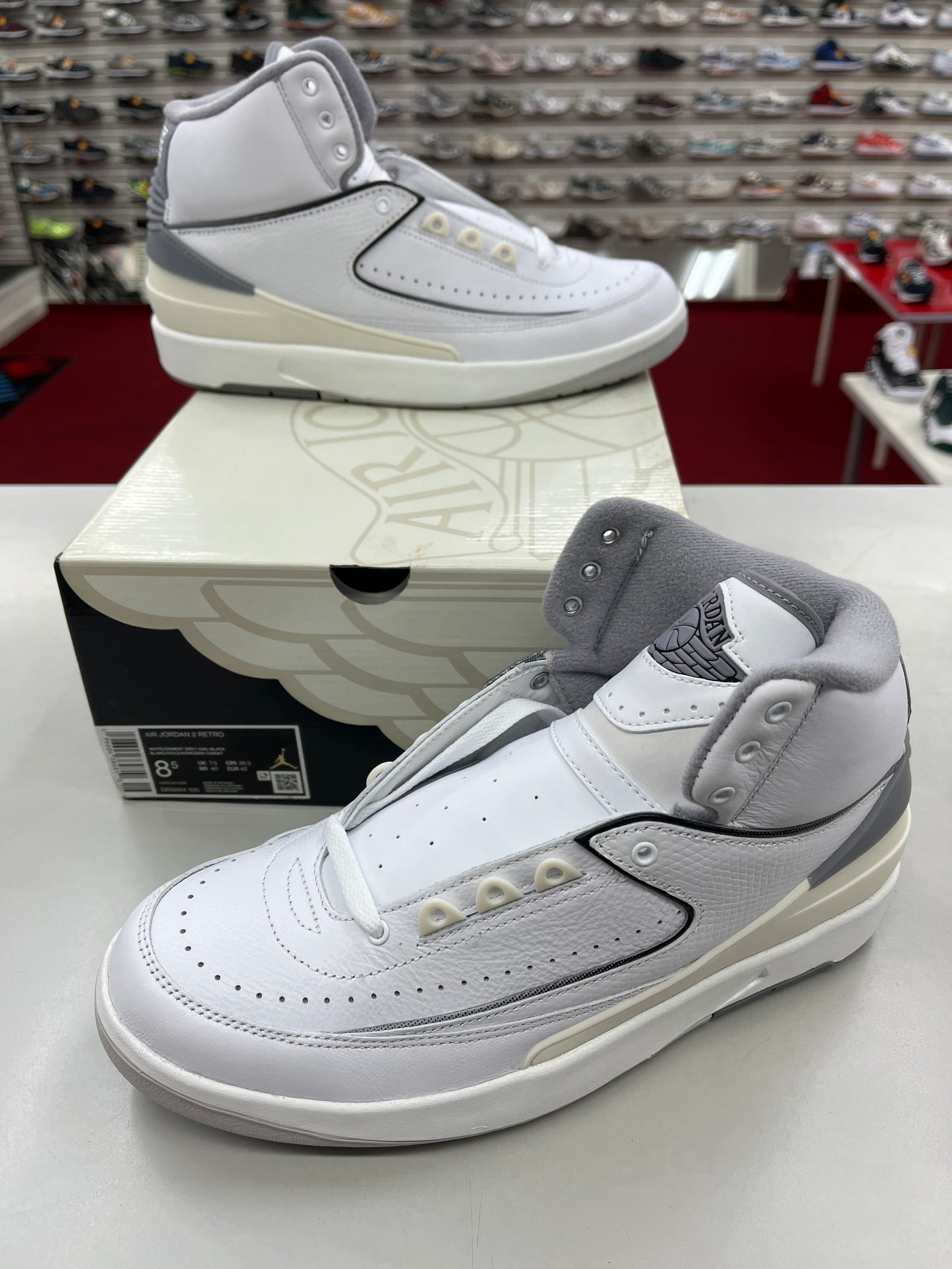 SZ 8.5 Men.      2023 Jordan 2 Retro white cement grey.